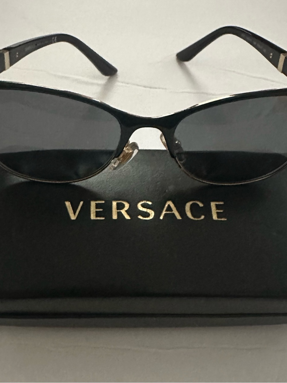 Versace Black Frame Sunglasses with Dark Lenses and Gold Accents